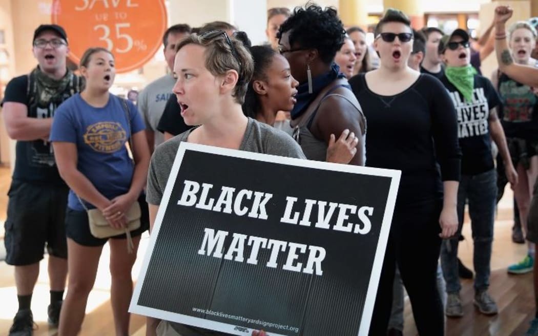 Demonstrators march through the West County Mall protesting the acquittal of former St Louis police officer Jason Stockley.