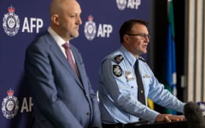 ASIO spy chief Mike Burgess (left) and AFP Commissioner Reece Kershaw.