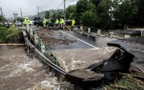 A road damaged after floods due to heavy rains on Tahiti.