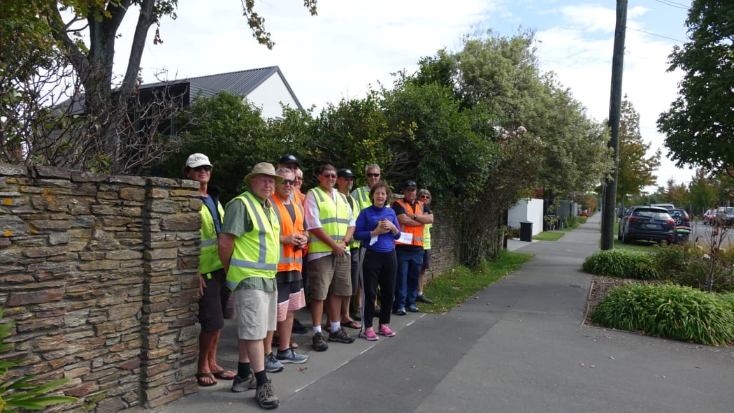Members of the Rail and Maritime Transport Union and supporters distributing leaflets outside the home of one of the directors of the Lyttelton Port Company.
