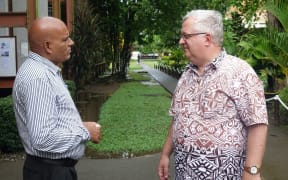 Unitech vice-chancellor Albert Schram (right) talks to a colleague on the institution's Lae campus
