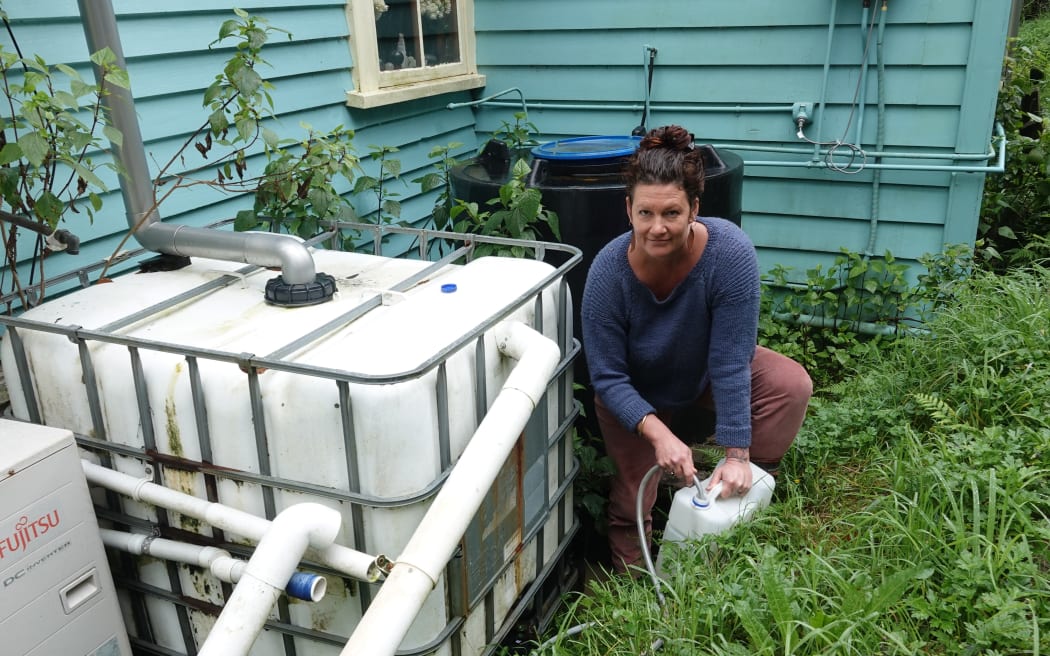 Kāeo chef Anna Valentine demonstrates the rigmarole involved in getting drinkable water.