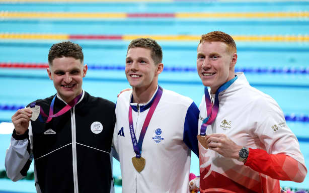 GLASGOW, SCOTLAND - JULY 24: Gold medalist Duncan Scott of Team Scotland, Silver medalist Lewis Clareburt of Team New Zealand and Bronze medalist Thomas Dean of Team England pose for a photo after the medal ceremony for the Men’s 200m Individual Medley Final on day one of the Glasgow 2026 Commonwealth Games at Tollcross International Swimming Centre on July 24, 2026 in Glasgow, Scotland. (Photo by Michael Steele/Getty Images)