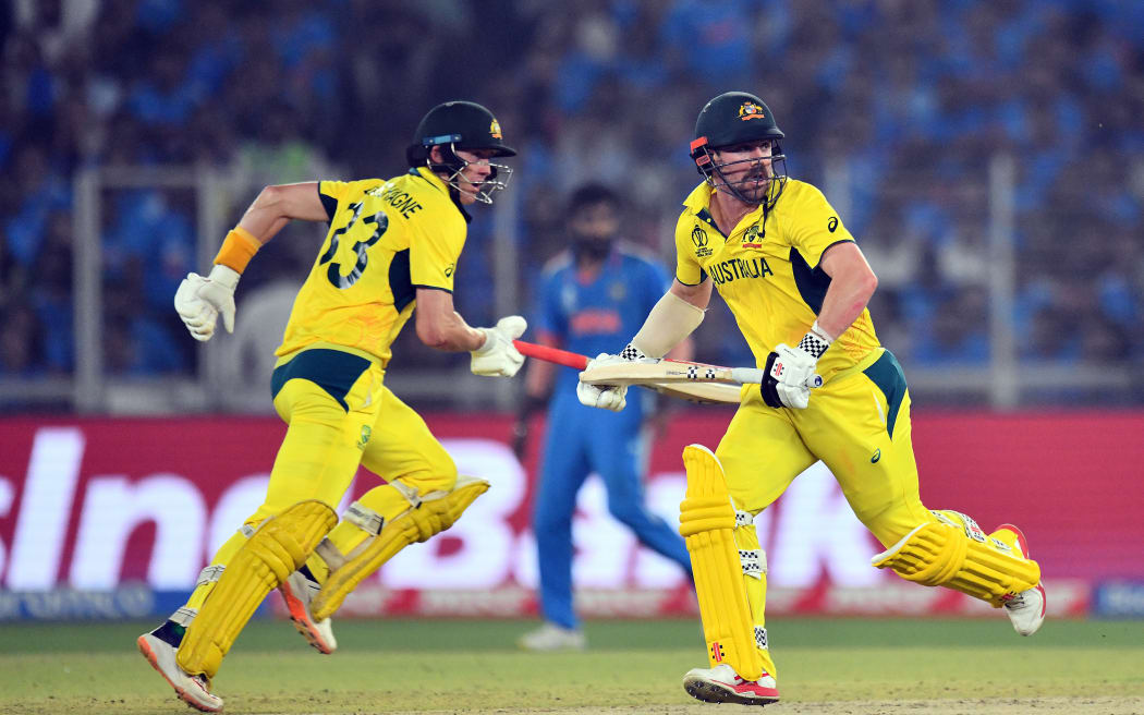 Australia's Marnus Labuschagne (L) and Travis Head (R) cross over for a run during the 2023 ICC Cricket World Cup final against India.