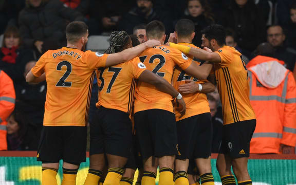 Wolves players celebrate.