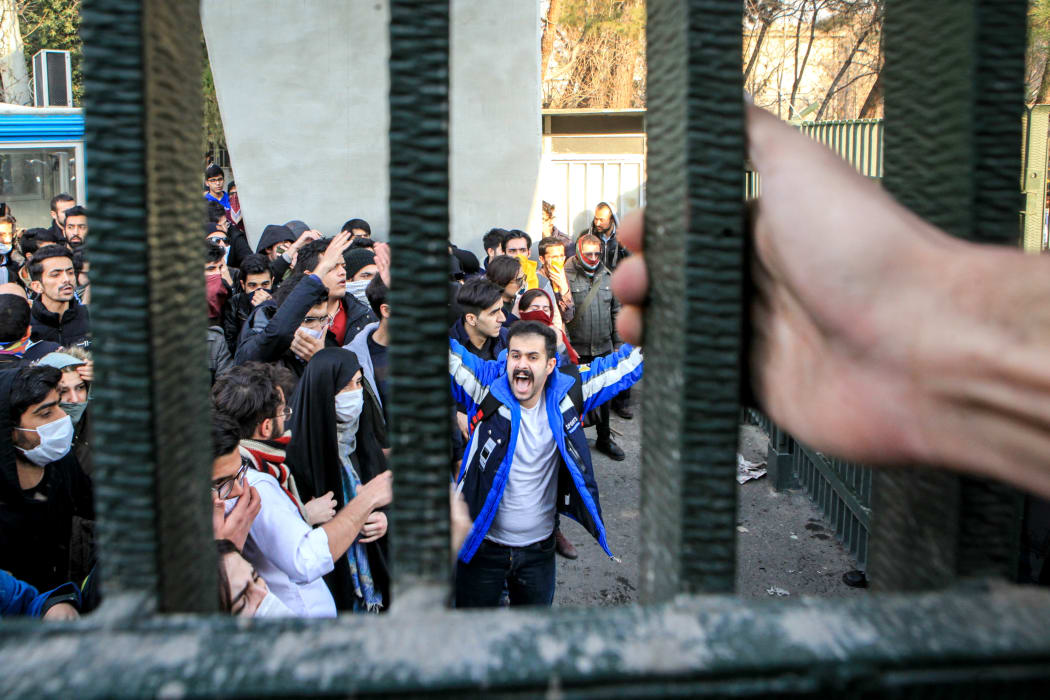 People gather to protest over high cost of living in Tehran, Iran on December 30, 2017.