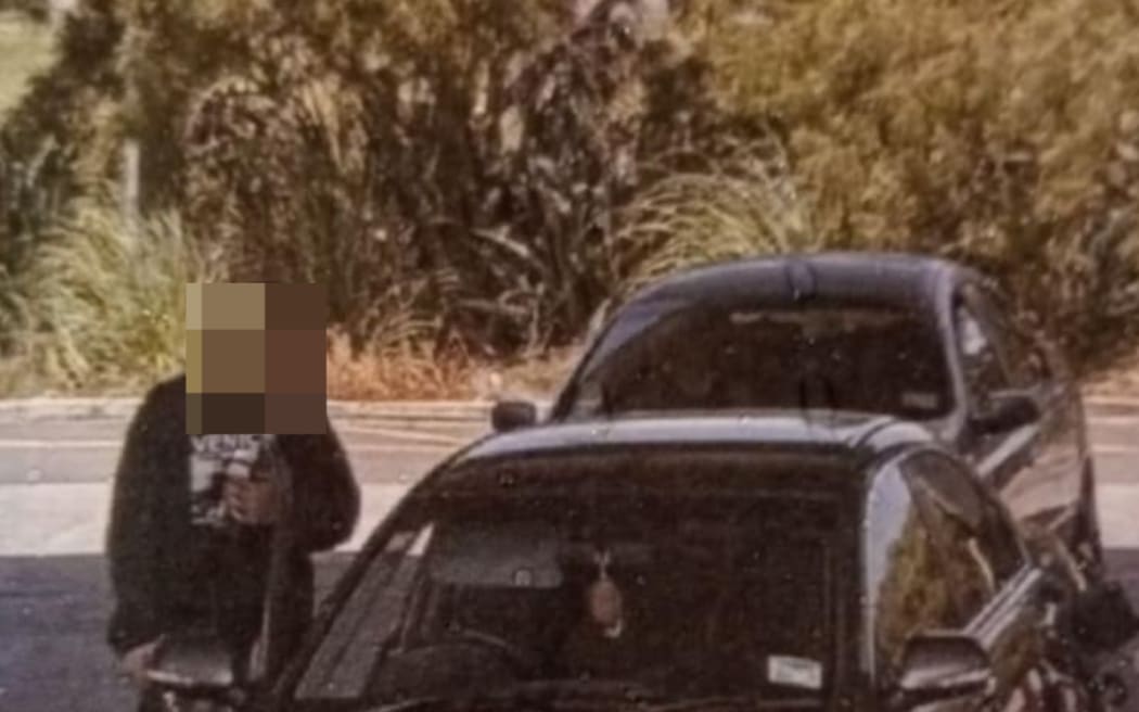 A person caught on CCTV filling up Chloe Mather's car with petrol.