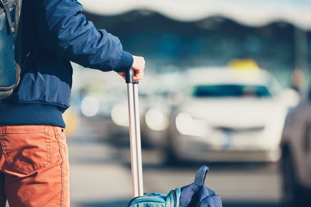 A passenger waiting for a taxi.