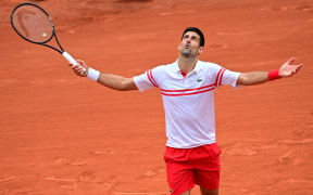 Serbia's Novak Djokovic reacts during his men's singles fourth round tennis match against  Italy's Lorenzo Musetti on Day 9 of the 2021 French Open in Paris on June 7, 2021.