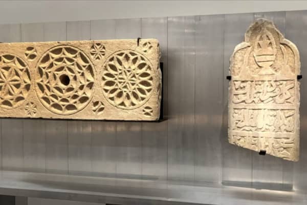A limestone lintel with three large rosettes and an oculus from the 19th century Ottoman period.