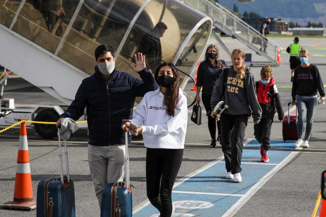 Passengers arriving in Queenstown on the first flight from Auckland on Wednesday 15 December 2021.