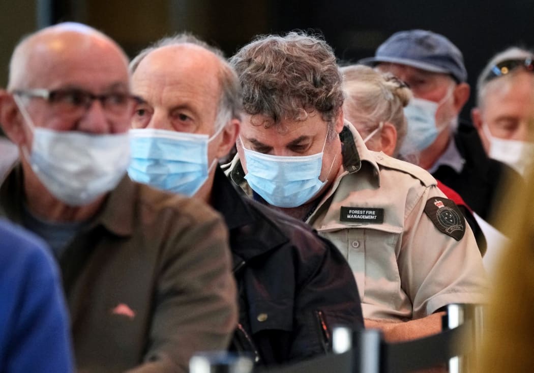People visit a mass vaccination centre to receive a Covid-19 vaccine in Melbourne on April 21, 2021. (Photo by LUIS ASCUI / POOL / AFP)
