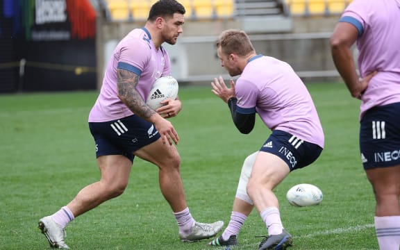 All Blacks Codie Taylor (L) trains with captain Sam Cane.
