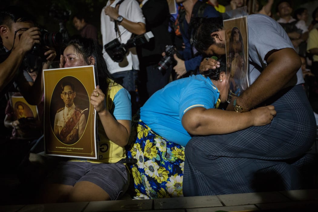 People outside the hospital where King Bhumibol Adulyadej died were stricken with grief when the news of his death was announced.