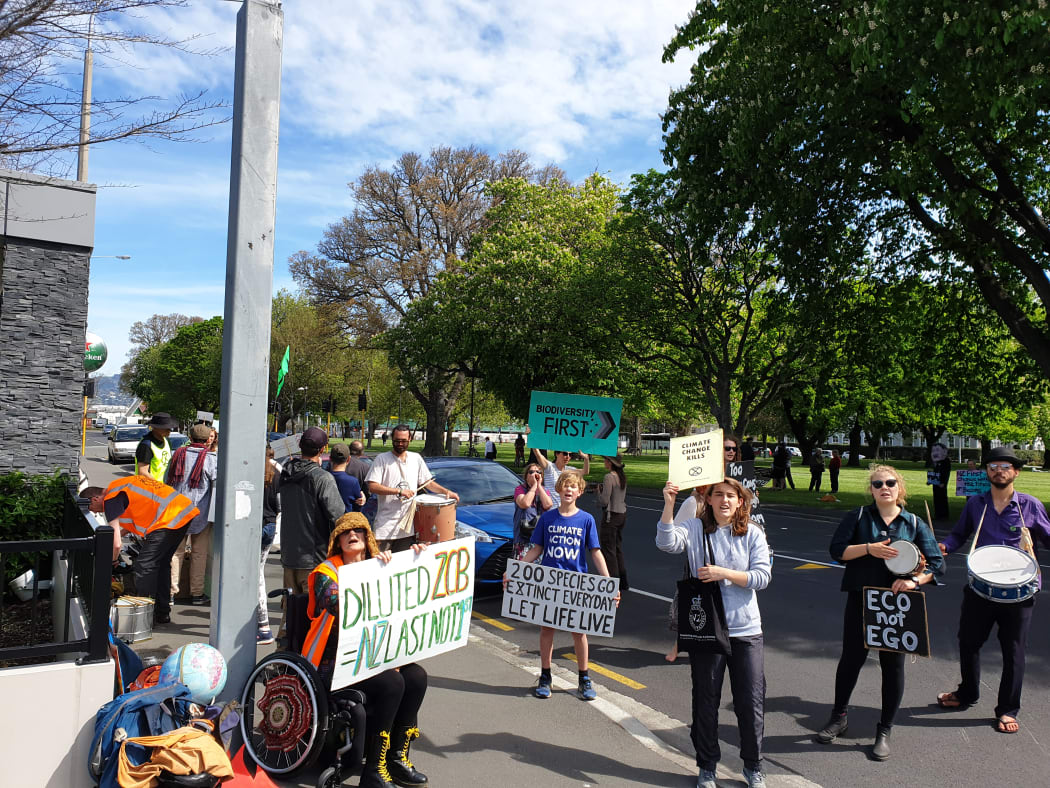 Environmental protesters, outside the NZ First conference in Christchurch today.