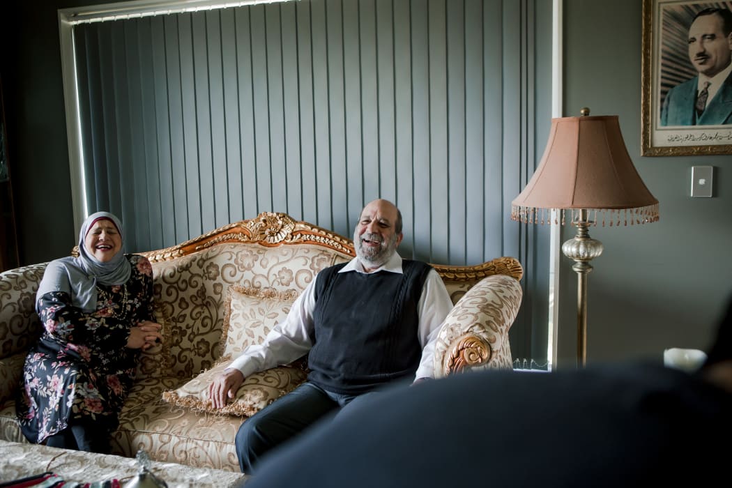 Mayssaa and her husband Mahmud laughing during an interview at their home in Kirikiriroa