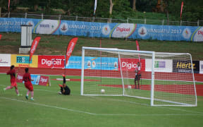 Tongan captain Penateti Feke scores against the Solomons