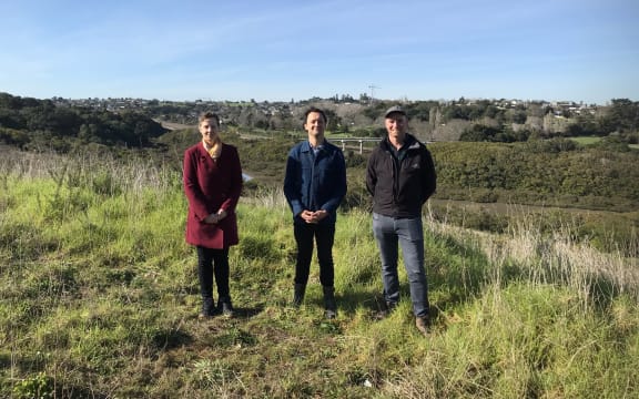 The team from AUT stand on the top of the slope looking down towards Pourewa Creek.
