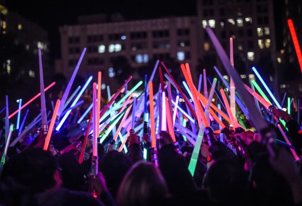 LOS ANGELES, CA - DECEMBER 18: Fans gather for the Star Wars Lightsaber Battle "The Light Battle Tour" at Pershing Square on December 18, 2015 in Los Angeles, California.