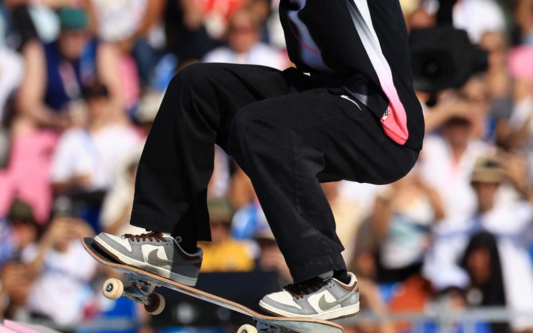 Japan's Yuto Horigome pulls off the final trick during the men's skateboarding street final.