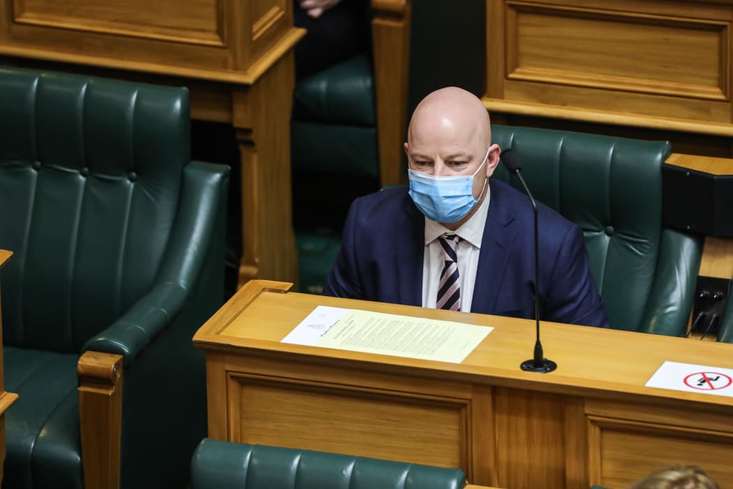 National MP Matt Doocey wearing a medical style mask in the House