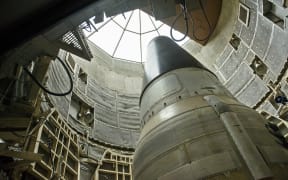 A deactivated Titan II  nuclear ICMB is seen in a silo at the Titan Missile Museum on May 12, 2015 in Green Valley, Arizona. The museum is located in a preserved Titan II ICBM launch complex and is devoted to educating visitors about the Cold War and the Titan II missile's contribution as a nuclear deterrent. AFP PHOTO/BRENDAN SMIALOWSKI (Photo by BRENDAN SMIALOWSKI / AFP)