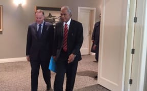 John Key walks with 'Akilisi Pohiva at Government House in Auckland