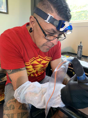 Tipi working on Emma's tā moko