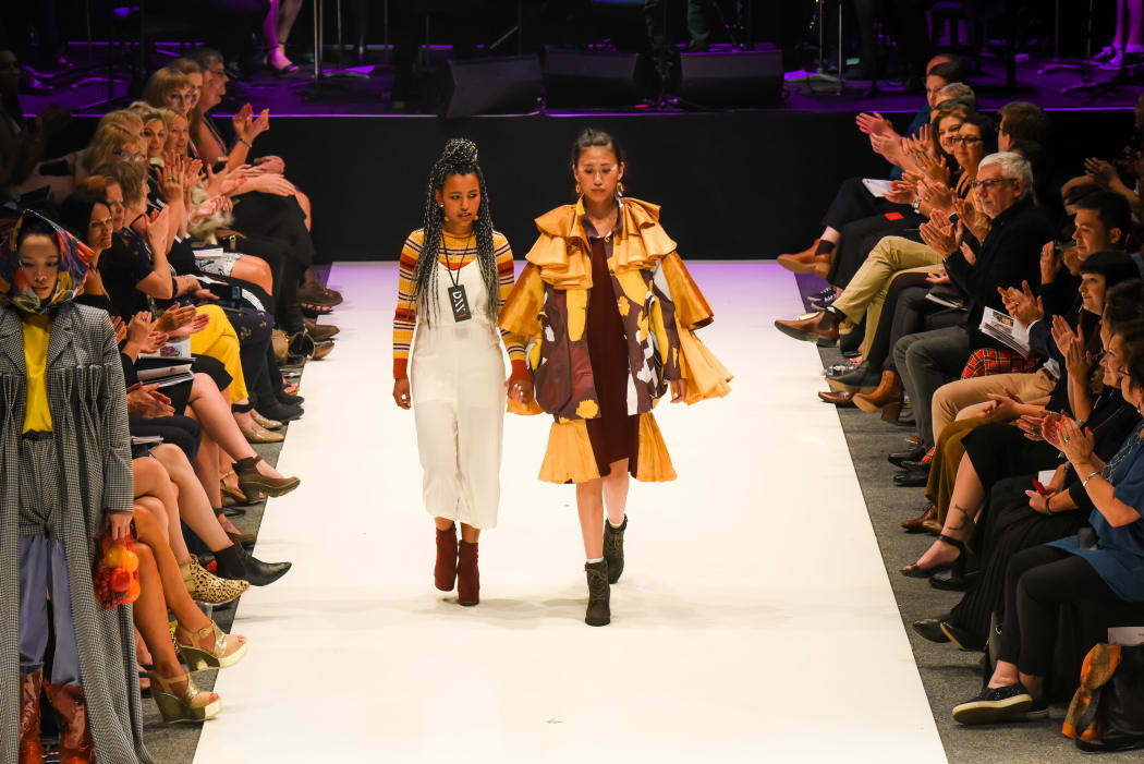 Tsega walks with her model at iD Fashion Week 2019 iD International Emerging Designer Awards. Regent Theatre, Dunedin, New Zealand. Friday 15 March 2019. Photo: Chris Sullivan/iD Dunedin