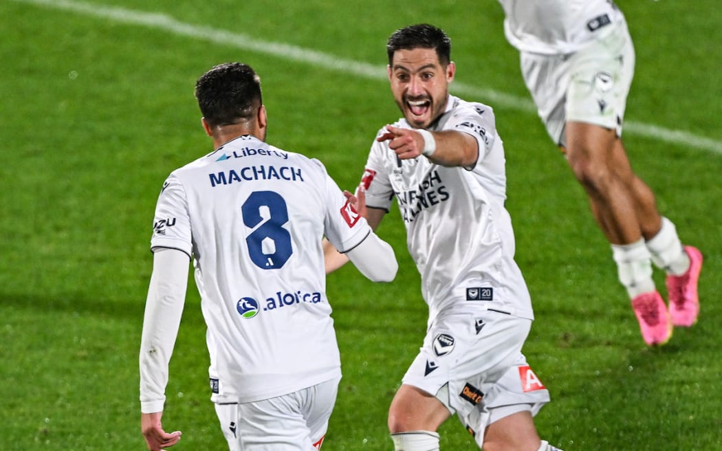 Zinédine Machach of Melbourne Victory celebrates his goal against Auckland FC with Bruno Fornaroli. 24 May, 2025.