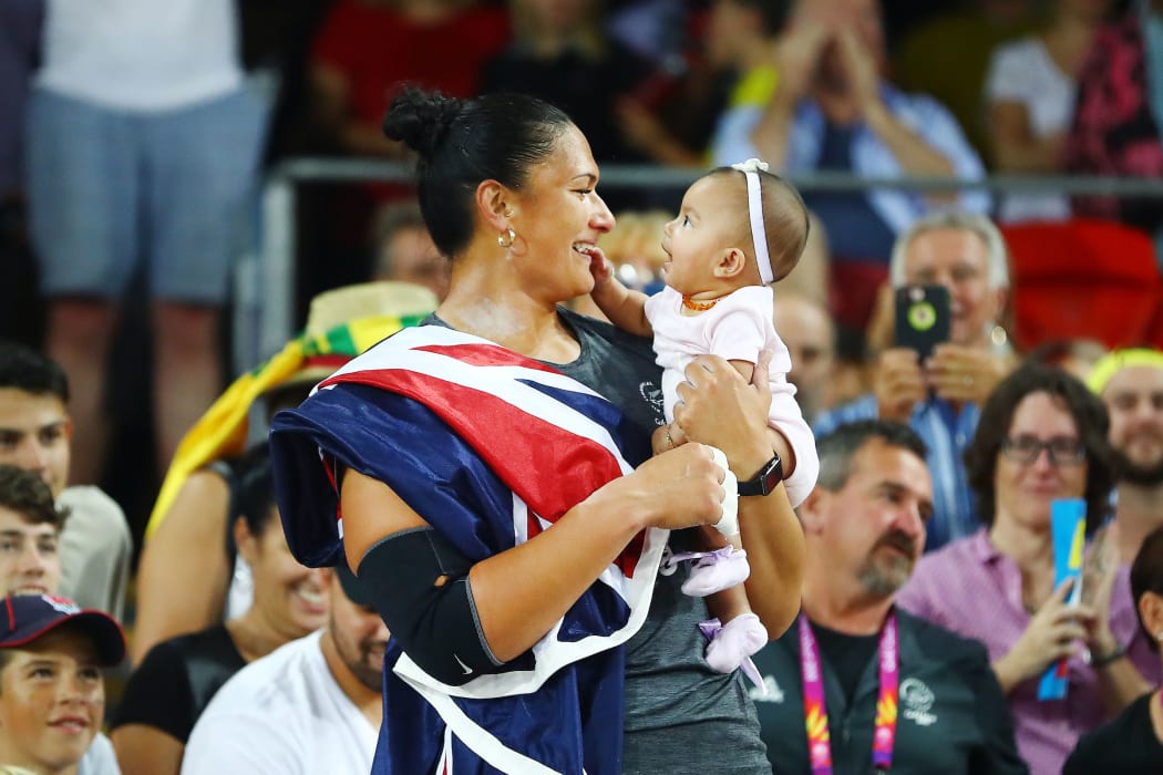 Dame Valerie Adams of New Zealand celebrates with her baby daughter Kimoana Josephine Adams Price