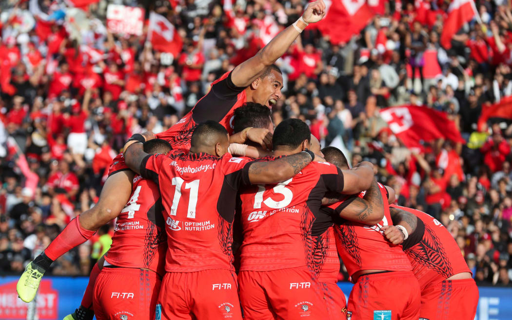 Tonga celebrate a try.