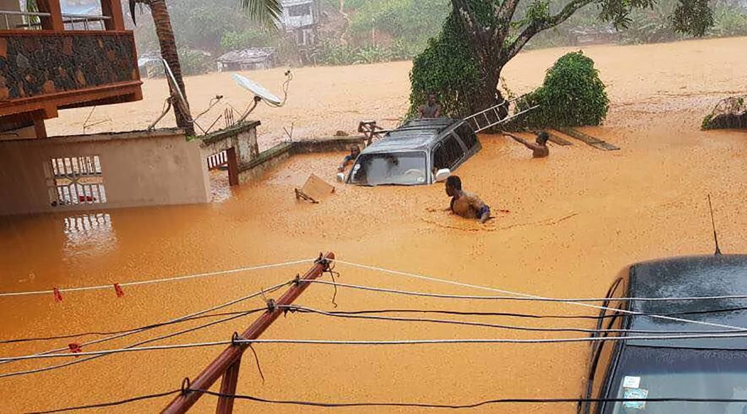 This handout picture released on August 14, 2017, by Society 4 Climate Change Communication Sierra Leone, shows flooded streets in Regent near Freetown.