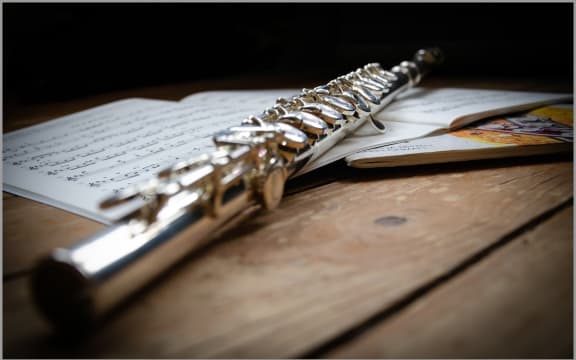 Flute on sheet music