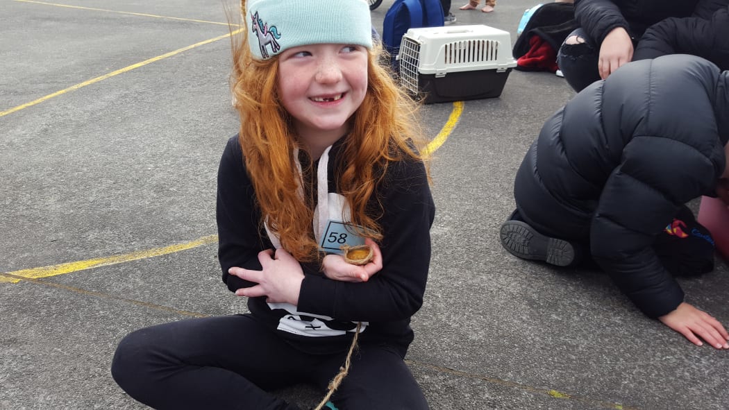 Alizae Greenall, 6 and her pet rock.