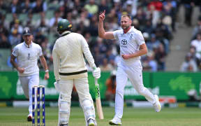 Gus Atkinson of England celebrates after taking the wicket of Usman Khawaja of Australia during the fourth Ashes test.