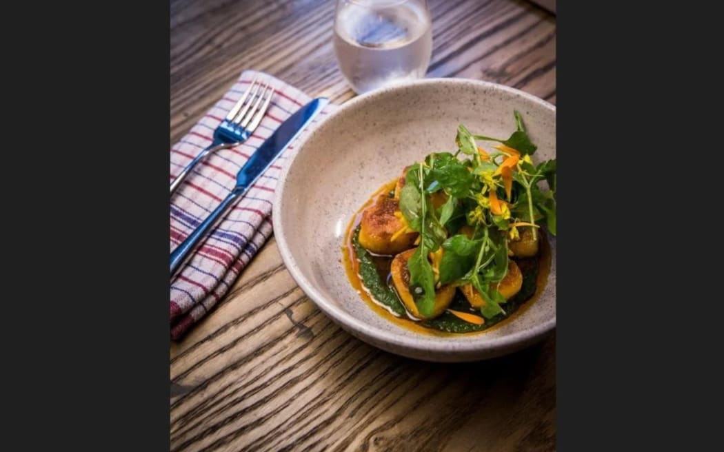 A dish served at Shepherd; kumara gnocchi with nettle sauce & njuda dressing.