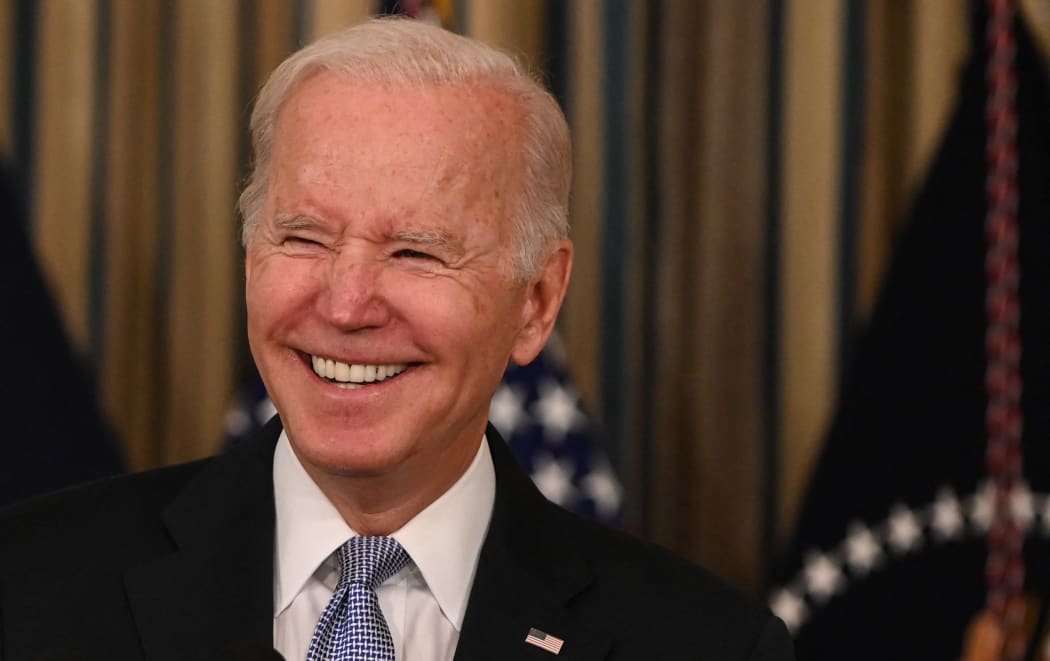 US President Joe Biden reacts as he delivers remarks on the passage of the Bipartisan Infrastructure Deal and the rule that will allow the passage of the Build Back Better Act in the State Dining Room at the White House in Washington, DC on November 6, 2021.