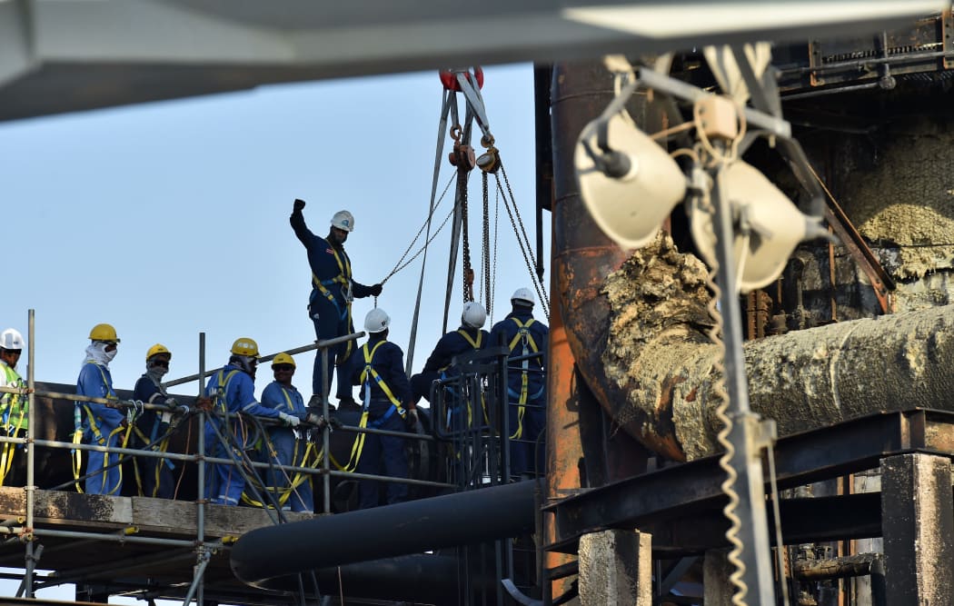 Employees of Aramco oil company work in Saudi Arabia's Abqaiq oil processing plant on September 20, 2019.