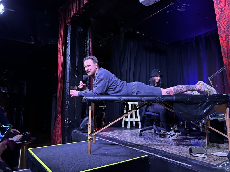 Ivan Fadjukoff mid-performance, mid-tattoo.