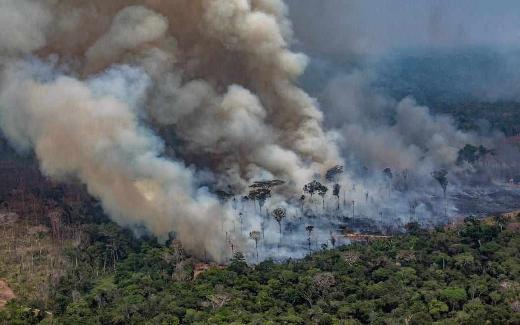 Smoke billowing from forest fires in the municipality of Candeias do Jamari, close to Porto Velho in Rondonia State, Brazil, 24 August 2019.