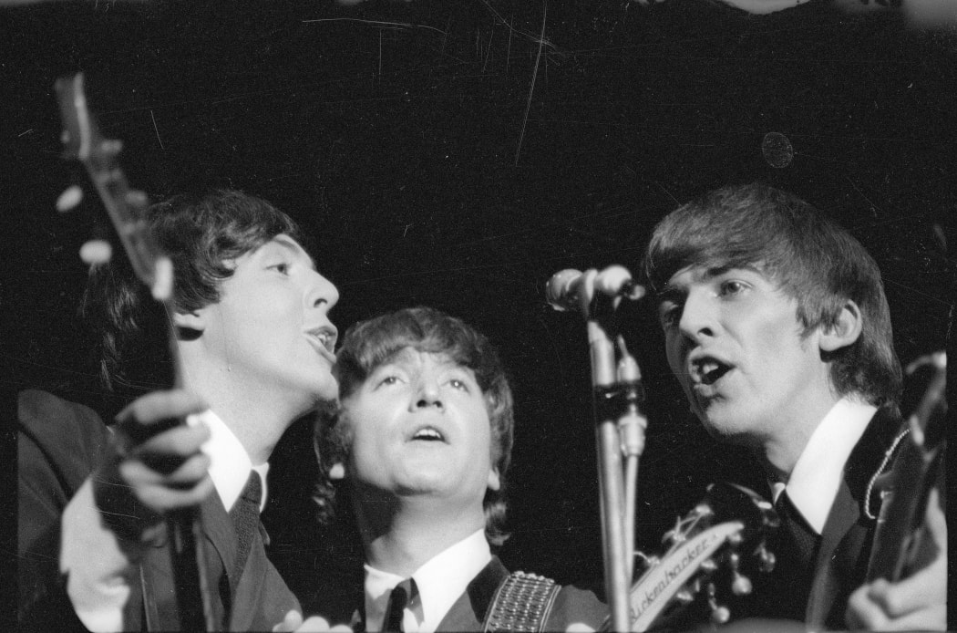 The Beatles - Paul McCartney, John Lennon and George Harrison singing during their 1964 Wellington Concert