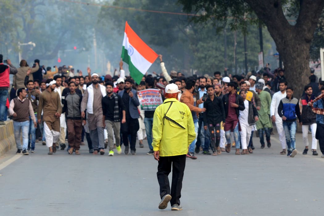 Protesters shout slogans with placards on road  at a demonstration against India's new citizenship Law in Allahabad on December 20, 2019.