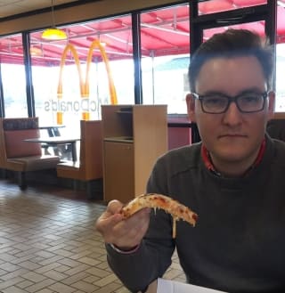 Brian Thompson enjoying a rarely spotted McDonald's pizza (Supplied)