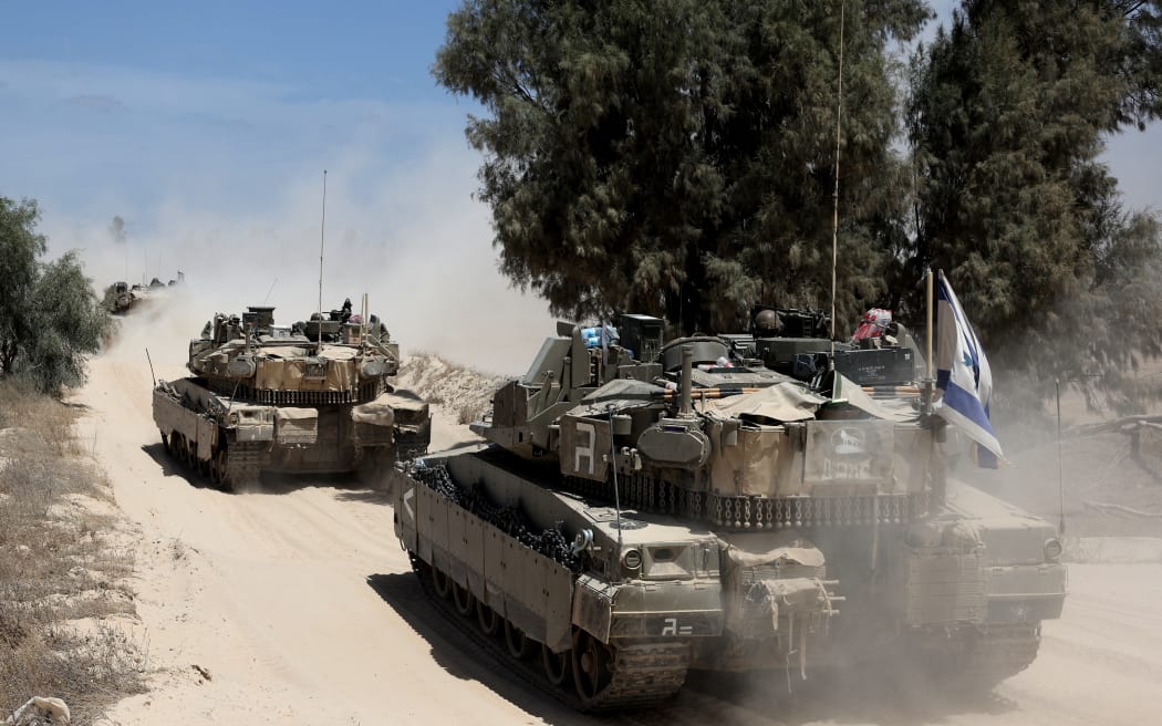 Israeli military vehicles deploy at Israel's southern border with the Gaza Strip  on May 20, 2025 amid the ongoing war with the Palestinian militant movement Hamas. (Photo by Jack GUEZ / AFP)