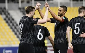 Chris Wood celebrates with Winston Reid.