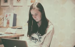 teenage girl on laptop