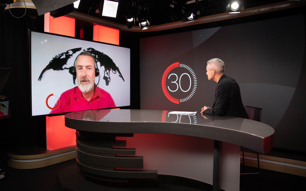 Geopolitics expert Peter Zeihan talks in studio with RNZ's Guyon Espiner.