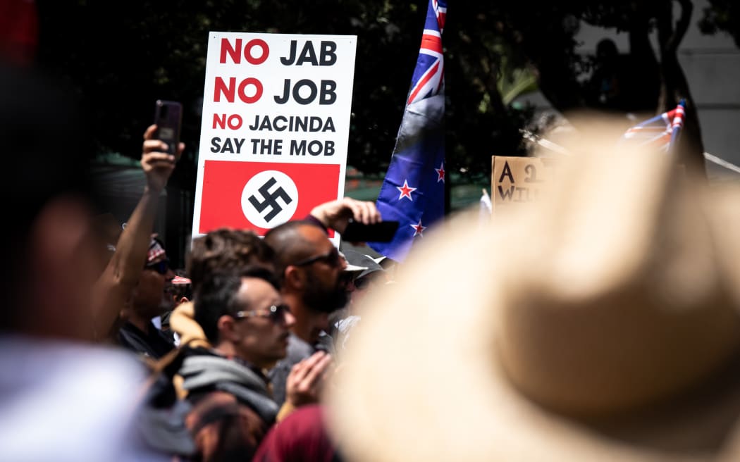 'No jab no job no Jacinda say the mob'. Mob is an interesting self-description. Often when people protest against what they see as facism they draw a diagonal through a swastika. At this protest there were many but I saw none crossed out.