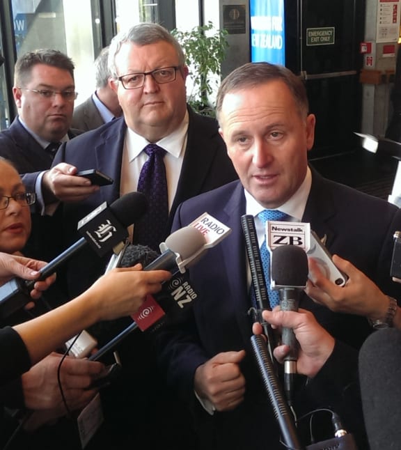 John Key and Gerry Brownlee talking to reporters about the transport policy.